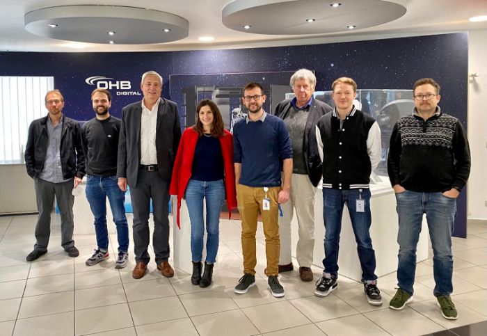 group photo of 8 people smiling