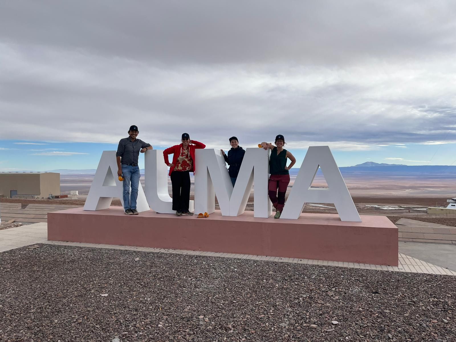 Scientists posing at the ALMA facility in front of the beautiful Atacama desert. From left to right: Luis Ramirez Camargo, Marianna Zeyringer, Maria Luisa Lode, Isabelle Viole.
&amp;#160;