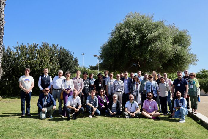 group photos of people standing in a green area